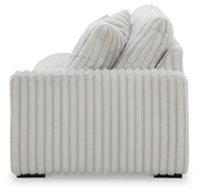 Ashley Furniture Stupendous sectional sofa with plush cushions and modern design, shown from a side view against a neutral background.