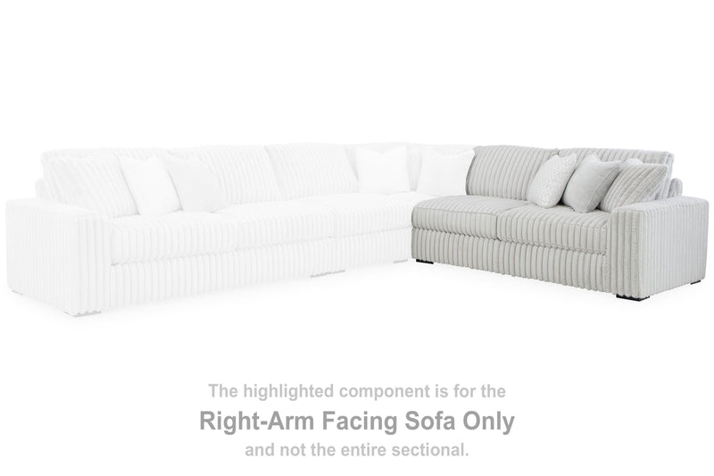 Ashley Furniture Stupendous Sectional sofa with plush cushions and modern design, shown in a cozy living room setting.