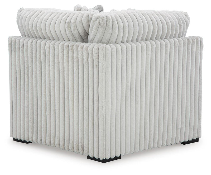 Ashley Furniture Stupendous sectional sofa with plush cushions and modern design, shown from the back view.