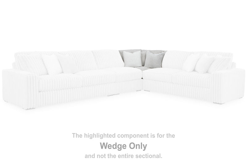 Ashley Furniture Stupendous Sectional sofa with plush cushions and modern design, shown in a cozy living room setting.