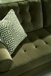 Close-up of the Reveon Lakes Sofa by Ashley Furniture, showcasing textured tufted fabric and plush cushioning.