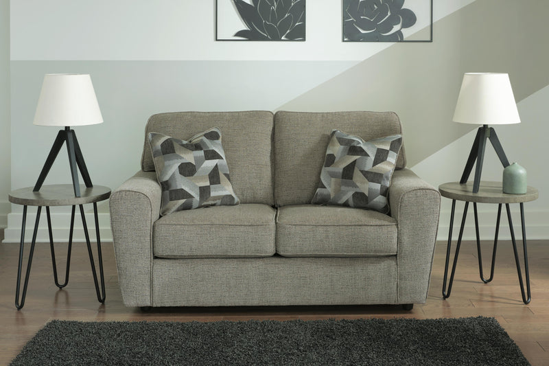 Ashley Furniture Cascilla Loveseat with plush fabric upholstery and cushioned armrests, perfect for a cozy living room.