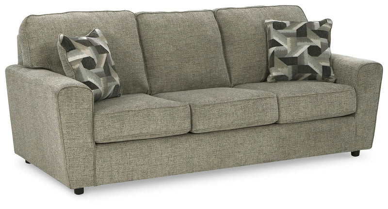 Ashley Furniture Cascilla living room set with plush sofa and armchair, shown from an angled side view in a modern living space.