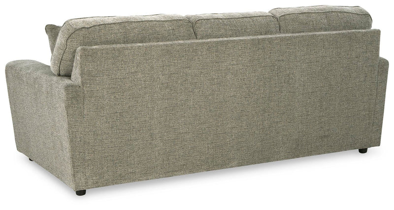 Ashley Furniture Cascilla living room set featuring a sofa, loveseat, and armchair with neutral fabric upholstery and modern design.