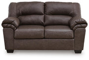 WillowBend Ashley Furniture living room set with sofa and armchair in a cozy living space, featuring neutral upholstery and wooden accents.
