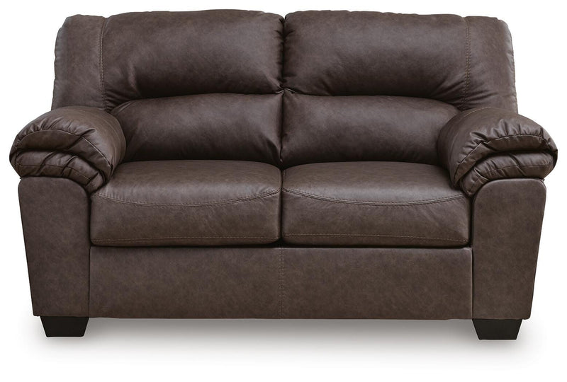 WillowBend Ashley Furniture living room set with sofa and armchair in a cozy living space, featuring neutral upholstery and wooden accents.