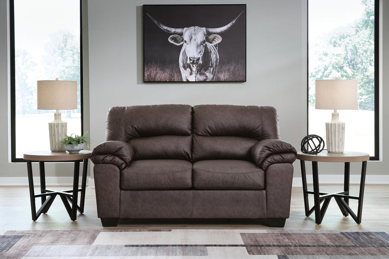 Ashley Furniture WillowBend living room set featuring a sofa and armchair with neutral upholstery and wooden legs.