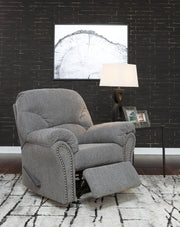 Ashley Furniture Allmaxx living room set with sofa, loveseat, and coffee table arranged in a modern living space.