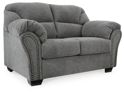 Ashley Furniture Allmaxx loveseat with plush fabric and angled design, showing a comfortable seating area with decorative cushions.