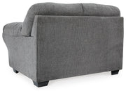 Ashley Furniture Allmaxx loveseat with plush fabric and cushioned backrest in a stylish living room setting.