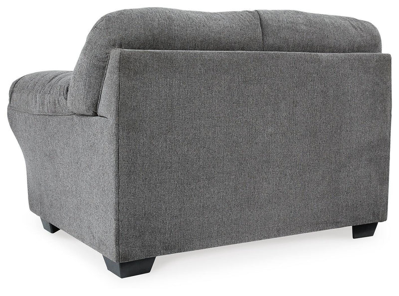 Ashley Furniture Allmaxx loveseat with plush fabric and cushioned backrest in a stylish living room setting.