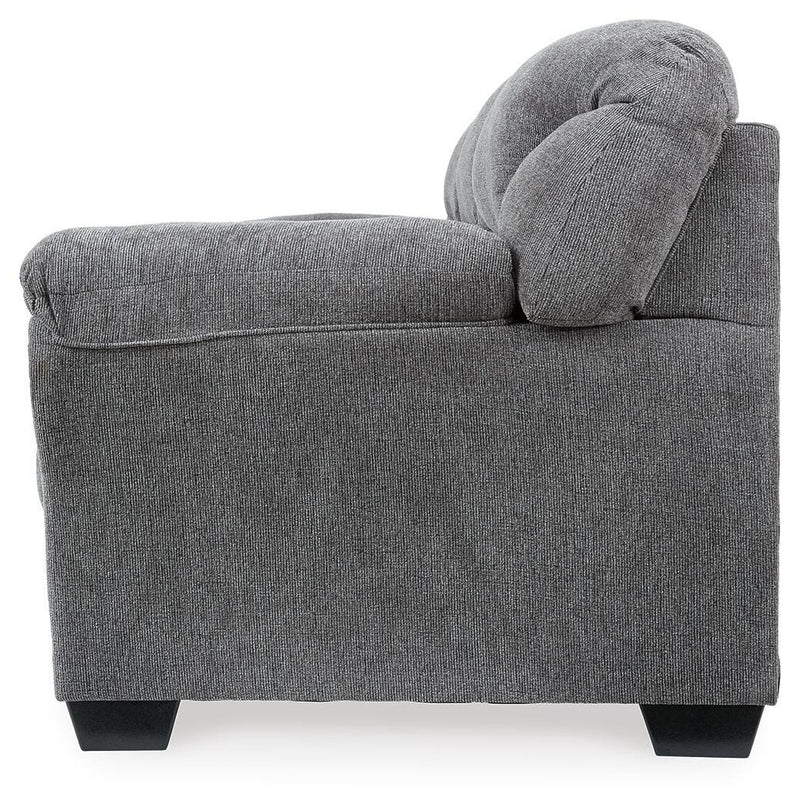 Ashley Furniture Allmaxx sofa shown from the side with plush cushions and wooden legs, modern living room furniture piece.