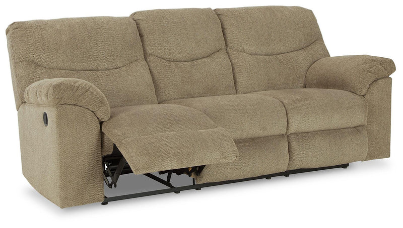 Ashley Furniture Alphons living room set with open sectional sofa and matching coffee table in a modern living space.