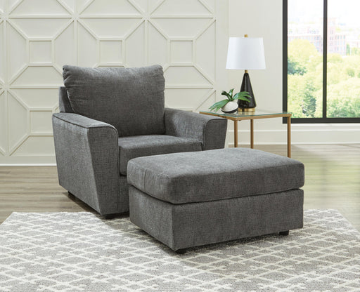 Ashley Furniture Stairatt living room set with sofa, loveseat, and armchair in a modern design, arranged in a cozy living space.