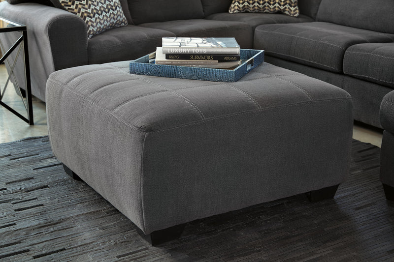 Ashley Furniture Ambee living room set featuring a sofa, loveseat, and armchair with neutral upholstery and modern design.