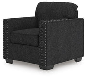Ashley Furniture Jasmine Peaks chair with woven fabric upholstery and wooden legs, shown from an angled side view.