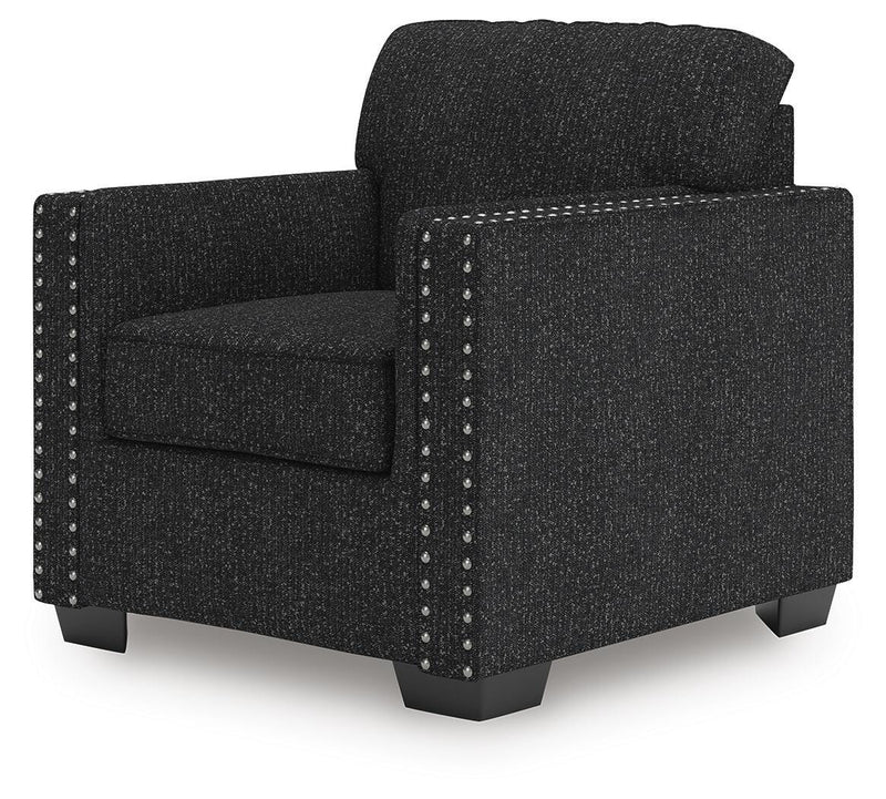 Ashley Furniture Jasmine Peaks chair with woven fabric upholstery and wooden legs, shown from an angled side view.