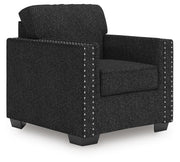 Ashley Furniture Jasmine Peaks Chair with plush fabric and wooden legs, shown from an angled view.