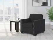 Jasmine Peaks chair by Ashley Furniture showing a stylish upholstered chair with patterned fabric and wooden legs.