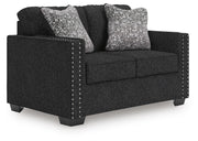 Ashley Furniture Jasmine Peaks loveseat with plush fabric and cozy cushions, viewed from an angled side perspective.