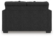 Ashley Furniture Jasmine Peaks loveseat with plush fabric and cushioned back, ideal for cozy living room seating.