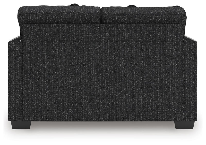 Ashley Furniture Jasmine Peaks loveseat with plush fabric and cushioned back, ideal for cozy living room seating.