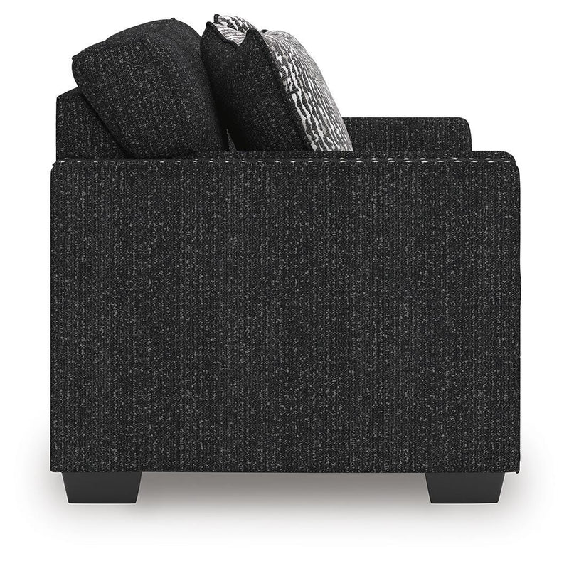 Ashley Furniture Jasmine Peaks loveseat with plush upholstery and cozy armrests, perfect for small living rooms.