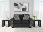 Ashley Furniture Jasmine Peaks loveseat featuring plush fabric upholstery and cushioned armrests for comfortable seating.