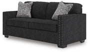 Ashley Furniture Jasmine Peaks sofa shown from an angled side view, featuring plush cushions and stylish upholstery.