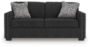 Ashley Furniture Jasmine Peaks sofa with plush cushions and neutral fabric, shown from a front head-on view.