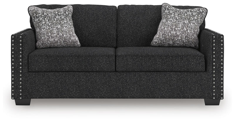 Ashley Furniture Jasmine Peaks sofa with plush cushions and neutral fabric, shown from a front head-on view.