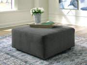 Ashley Furniture Edenfield oversized accent ottoman with neutral fabric and plush cushioning, suitable as a stylish living room accent piece.