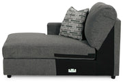 Ashley Furniture Edenfield living room set with a sectional sofa and matching ottoman in a modern, neutral fabric.