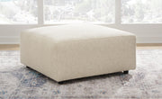 Ashley Furniture Edenfield oversized accent ottoman with plush fabric and sturdy wooden legs, perfect for living room decor.