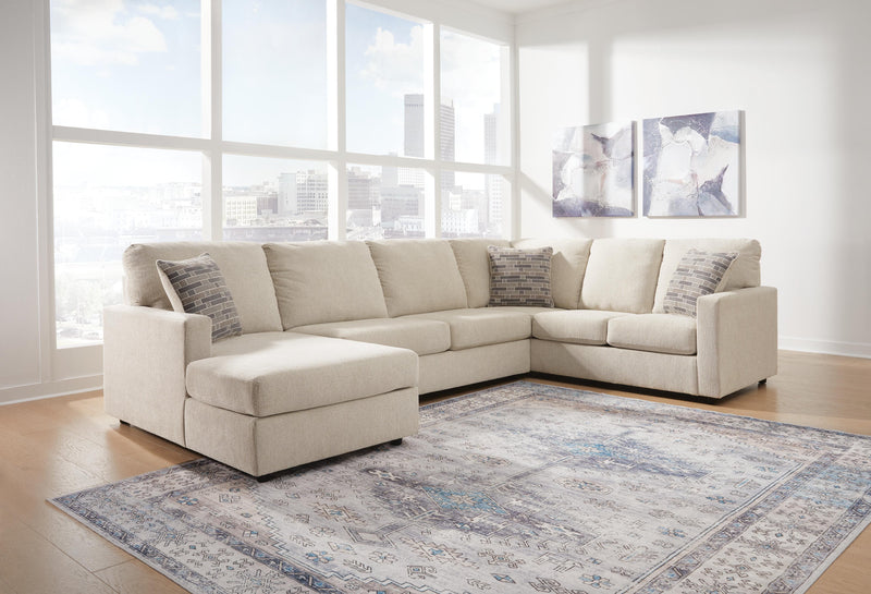 Ashley Furniture Edenfield living room set with beige sofa and armchair in a modern design, featuring plush cushions and stylish fabric.