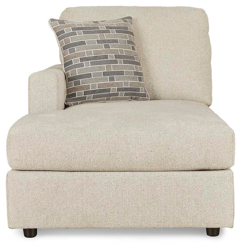 Ashley Furniture Edenfield 3-piece sectional with chaise, showing plush fabric, wide armrests, and modern design for comfortable seating.