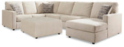 Ashley Furniture Edenfield living room set with a sofa, loveseat, and armchair in neutral upholstery, arranged in a modern living space.