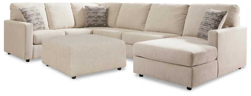 Ashley Furniture Edenfield living room set with a sofa, loveseat, and armchair in neutral upholstery, arranged in a modern living space.
