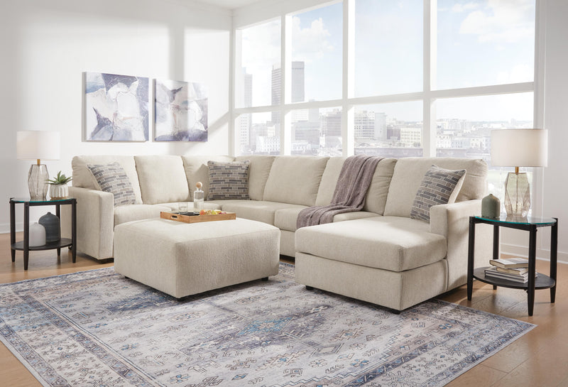Ashley Furniture Edenfield living room set with sofa and loveseat in neutral fabric, arranged in a cozy living space.
