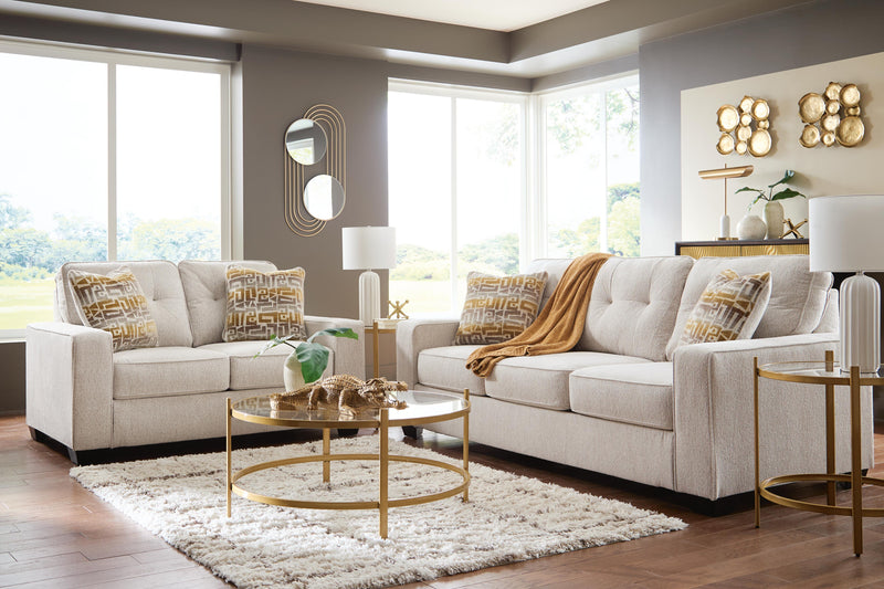 Ashley Furniture Larimer living room set includes a sofa and loveseat in a modern upholstery with plush cushions and wooden legs.