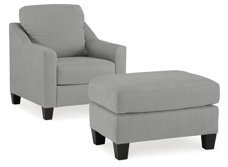 Ashley Furniture Adlai living room set with sofa and armchair in a modern design, featuring neutral upholstery and wooden legs.