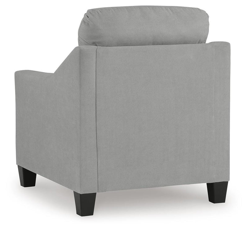 Ashley Furniture Adlai living room set with sofa and armchair, featuring neutral upholstery and wooden legs in a modern design.