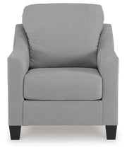 Ashley Furniture Adlai living room set with plush sofa and matching armchair, featuring neutral upholstery and modern design.