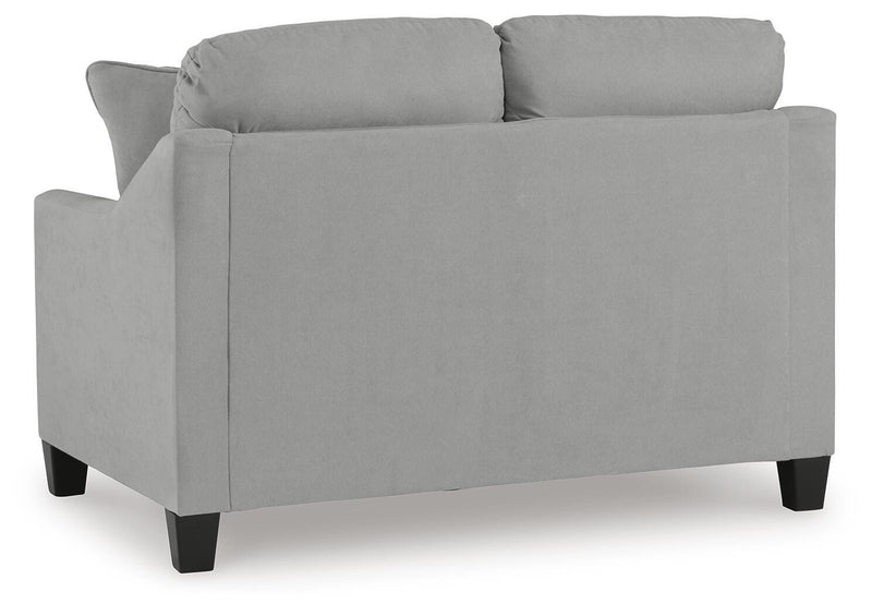 Ashley Furniture Adlai Living Room Set with sofa and armchair, featuring neutral fabric and modern design, shown from the back.
