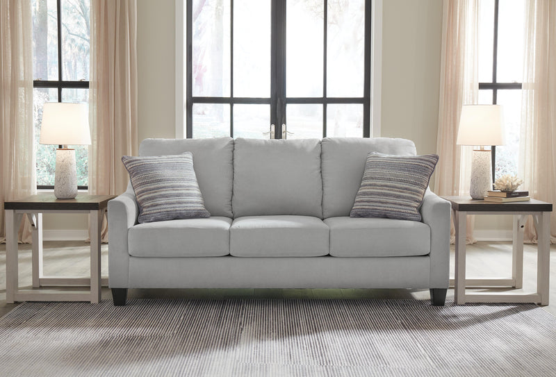 Ashley Furniture Adlai sleeper sofa with plush upholstery and fold-out bed in a modern living room setting.
