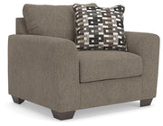 Ashley Furniture Triston-Peaks oversized chair with plush upholstery and wide armrests, shown from an angled side view.