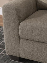 Ashley Furniture Triston-Peaks oversized chair with plush fabric, wide armrests, and modern design for comfortable living spaces.