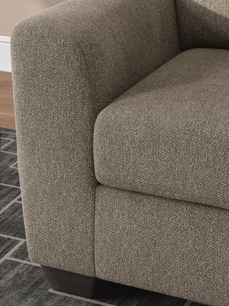 Ashley Furniture Triston-Peaks oversized chair with plush fabric, wide armrests, and modern design for comfortable living spaces.
