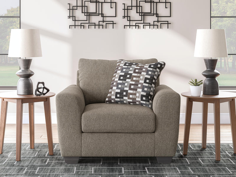 Oversized Triston-Peaks Ashley Furniture chair with plush fabric and wide cushioned seat in a modern living room setting.