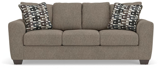 Ashley Furniture Triston-Peaks sofa with plush cushions and fabric upholstery, shown from a front head-on view.